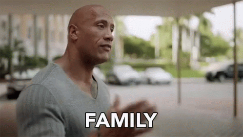 The Rock hugging someone. (Text) Family.